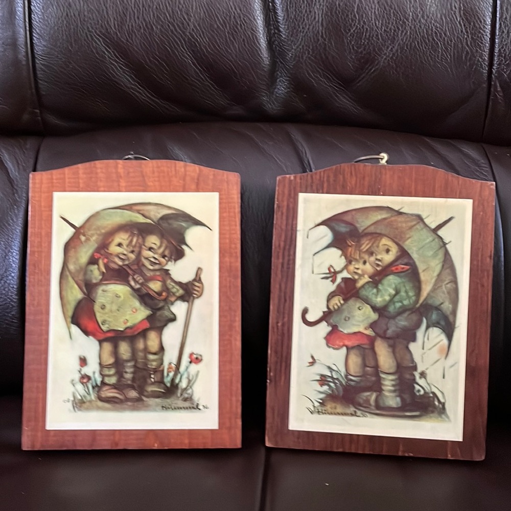 Two wooden Hummel plaques.